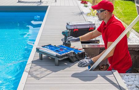 swimming pool maintenance technician performing system tune up in port st lucie, fl